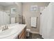 Bathroom featuring a white countertop vanity, a large mirror, and a shower with curtain at 19409 W 88Th Dr, Arvada, CO 80007