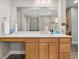Modern bathroom with a large mirror, a vanity with drawers, and tile flooring at 19409 W 88Th Dr, Arvada, CO 80007