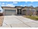 Charming home with a three-car garage and beautiful stone accents on the exterior at 19409 W 88Th Dr, Arvada, CO 80007