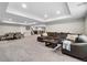 Large finished basement with living area, dining area, and bar, perfect for entertaining at 19409 W 88Th Dr, Arvada, CO 80007