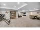 Spacious finished basement with neutral carpet and versatile layout for entertaining at 19409 W 88Th Dr, Arvada, CO 80007