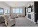 Cozy living room with mountain views, fireplace and stylish seating at 19409 W 88Th Dr, Arvada, CO 80007