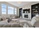 Inviting living room with large windows, fireplace and stylish decor at 19409 W 88Th Dr, Arvada, CO 80007