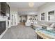 Spacious living room offering comfortable seating, lots of natural light and an open floor plan at 19409 W 88Th Dr, Arvada, CO 80007