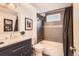 Finished basement bathroom with a modern vanity, tiled shower, and updated fixtures at 1255 S Hoyt St, Lakewood, CO 80232