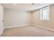 Finished basement bedroom with carpeted floors and a window at 1255 S Hoyt St, Lakewood, CO 80232