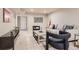 Cozy basement living room featuring neutral decor and a stylish area rug at 1255 S Hoyt St, Lakewood, CO 80232