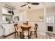 Charming dining area with seating for four and a view of the kitchen at 1255 S Hoyt St, Lakewood, CO 80232