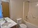 Bathroom with sink, toilet, mirror, and bathtub with standard shower head at 1415 S Pitkin Ct, Aurora, CO 80017
