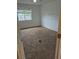 Bright bedroom with carpet and window, offering a comfortable space for rest and relaxation at 1415 S Pitkin Ct, Aurora, CO 80017