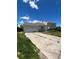 Charming two-story home featuring an attached garage and stone accents, set under a bright blue sky at 1415 S Pitkin Ct, Aurora, CO 80017