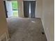Neutral living room with carpet and a bright front window at 1415 S Pitkin Ct, Aurora, CO 80017