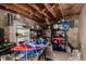 Cluttered basement storage area with shelving and assorted items at 117 6Th St, Frederick, CO 80530