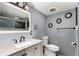 Modern bathroom featuring marble countertop vanity and decorative wall mirrors at 117 6Th St, Frederick, CO 80530