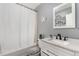 Bathroom featuring modern vanity with stone countertop, brushed nickel fixtures, and a shower-tub combination at 117 6Th St, Frederick, CO 80530