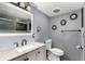 Updated bathroom with marble countertops, decorative mirrors, and a walk-in shower at 117 6Th St, Frederick, CO 80530