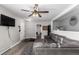 Comfortable living room featuring a large black sofa, offering a cozy atmosphere for relaxing at 117 6Th St, Frederick, CO 80530