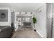 Open-concept view from the living room into dining area with stylish décor and ample natural light at 117 6Th St, Frederick, CO 80530