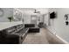 Spacious living room featuring neutral decor, a ceiling fan, and large windows for natural light at 117 6Th St, Frederick, CO 80530