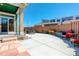 Spacious backyard patio with seating area and privacy fence, perfect for outdoor living at 8272 E 55Th Pl, Denver, CO 80238