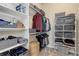 Organized walk-in closet featuring shelving, hanging rods, and storage bins for efficient organization at 8272 E 55Th Pl, Denver, CO 80238