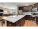 Spacious kitchen island with bar seating opens to the living area, perfect for entertaining at 8272 E 55Th Pl, Denver, CO 80238