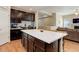 Spacious kitchen features dark cabinets, a large island, and stainless steel appliances at 8272 E 55Th Pl, Denver, CO 80238
