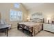 Tranquil main bedroom with neutral colors, vaulted ceiling, and ample natural light at 8272 E 55Th Pl, Denver, CO 80238