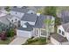 Aerial view of home with a stone and gray wood facade and trimmed front lawn at 8164 S York Ct, Centennial, CO 80122