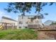 Wide, green, grass backyard with deck and playset at 8164 S York Ct, Centennial, CO 80122