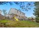 Wide, green, grass backyard with deck and playset at 8164 S York Ct, Centennial, CO 80122