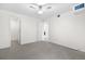This bedroom offers neutral carpet, ceiling fan with lights, and white trim at 8164 S York Ct, Centennial, CO 80122