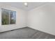 Simple bedroom with a neutral carpet, a fan and a window at 8164 S York Ct, Centennial, CO 80122