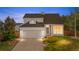 Charming two-story home features a two-car garage, stone accents, and well-maintained landscaping at 8164 S York Ct, Centennial, CO 80122