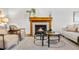 Cozy living room with a classic fireplace, plush seating, and stylish decor for a warm, inviting atmosphere at 8164 S York Ct, Centennial, CO 80122