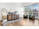 Bright living room with a large window, hardwood floors, and stylish furniture at 8164 S York Ct, Centennial, CO 80122