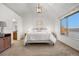 Spacious main bedroom with vaulted ceilings, a modern light fixture, and an en-suite bathroom at 8164 S York Ct, Centennial, CO 80122