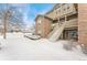 Two-story building exterior with snowy front yard at 18152 E Flora Pl # D, Aurora, CO 80013