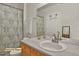 This bathroom has a single-sink vanity, toilet, and shower with a curtain rod at 14353 E 1St Dr # 302, Aurora, CO 80011