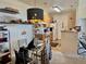 Eat-in kitchen features light wood cabinets, white appliances, and open dining space at 14353 E 1St Dr # 302, Aurora, CO 80011