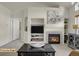 Living room features a fireplace, built-in shelving and view to an entry door at 14353 E 1St Dr # 302, Aurora, CO 80011