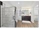 Modern bathroom with walk-in shower and double vanity at 22586 E Union Cir, Aurora, CO 80015