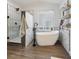 Spa-like bathroom with soaking tub and geometric tile at 22586 E Union Cir, Aurora, CO 80015