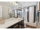 Bathroom with hexagon tile, white vanity, and bathtub at 22586 E Union Cir, Aurora, CO 80015