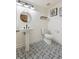 Basement bathroom with patterned floor and pedestal sink at 22586 E Union Cir, Aurora, CO 80015