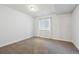 Bright and airy bedroom with neutral carpeting and large window at 22586 E Union Cir, Aurora, CO 80015