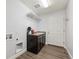 Laundry room with cabinets, shelving, and built-in sink at 22586 E Union Cir, Aurora, CO 80015