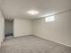 Finished basement with carpet flooring, a small window and recessed lighting at 7881 Kenwood St, Commerce City, CO 80022