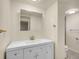 Modern bathroom featuring vanity, sink, mirror, modern faucet, and tile flooring at 7881 Kenwood St, Commerce City, CO 80022