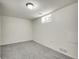 Finished basement bedroom with carpet flooring, and a small window at 7881 Kenwood St, Commerce City, CO 80022